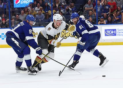 Mar 9, 2023; Tampa, Florida, USA; Tampa Bay Lightning center Steven Stamkos (91) and defenseman Erik Cernak (81) defend Vegas Golden Knights center Jack Eichel (9)  during overtime at Amalie Arena. Mandatory Credit: Kim Klement-USA TODAY Sports