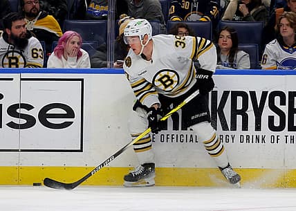 Dec 27, 2023; Buffalo, New York, USA;  Boston Bruins center Morgan Geekie (39) looks to make a pass during the third period against the Buffalo Sabres at KeyBank Center. Mandatory Credit: Timothy T. Ludwig-USA TODAY Sports
