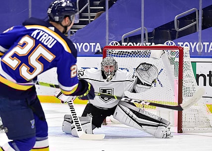 Jan 24, 2021; St. Louis, Missouri, USA;  Los Angeles Kings goaltender Jonathan Quick (32) defends the net against St. Louis Blues center Jordan Kyrou (25) during the first period at Enterprise Center. Mandatory Credit: Jeff Curry-USA TODAY Sports