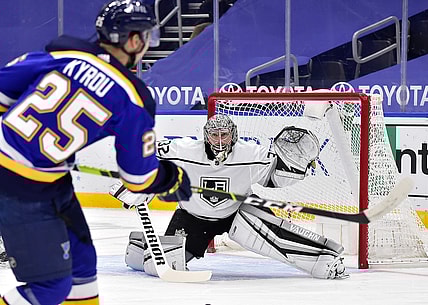 Jan 24, 2021; St. Louis, Missouri, USA;  Los Angeles Kings goaltender Jonathan Quick (32) defends the net against St. Louis Blues center Jordan Kyrou (25) during the first period at Enterprise Center. Mandatory Credit: Jeff Curry-USA TODAY Sports