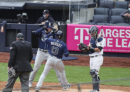 Apr 17, 2021; Bronx, New York, USA; Tampa Bay Rays left fielder Manuel Margot (13) is greeted at home plate by designated hitter Austin Meadows (17) after hitting a two run home run in the fourth inning against the New York Yankees at Yankee Stadium. Mandatory Credit: Wendell Cruz-USA TODAY Sports