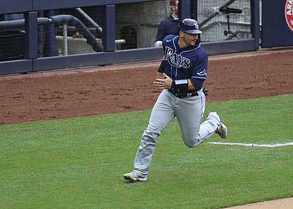 Apr 18, 2021; Bronx, New York, USA;  Tampa Bay Rays catcher Mike Zunino (10) heads home to score the tying run against the New York Yankees in the third inning at Yankee Stadium. Mandatory Credit: Wendell Cruz-USA TODAY Sports