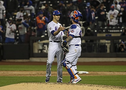 Apr 23, 2021; New York City, New York, USA; New York Mets pitcher Jacob deGrom (left) and catcher Tomas Nido (right) celebrate after defeating the Washington Nationals 6-0  at Citi Field. Mandatory Credit: Wendell Cruz-USA TODAY Sports