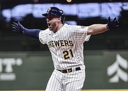 May 1, 2021; Milwaukee, Wisconsin, USA;  Milwaukee Brewers third baseman Travis Shaw (21) reacts after driving in the winning run with a base hit in the eleventh inning against the Los Angeles Dodgers at American Family Field. Mandatory Credit: Benny Sieu-USA TODAY Sports