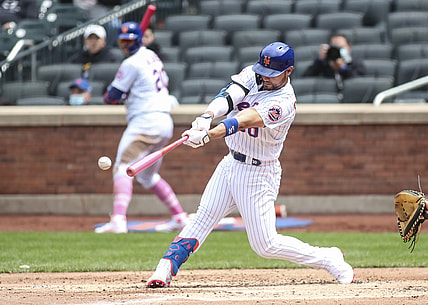 May 9, 2021; New York City, New York, USA;  New York Mets right fielder Michael Conforto (30) hits an RBI single in the third inning against the Arizona Diamondbacks at Citi Field. Mandatory Credit: Wendell Cruz-USA TODAY Sports