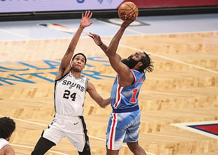 May 12, 2021; Brooklyn, New York, USA; Brooklyn Nets guard James Harden (R) shoots the ball over San Antonio Spurs guard Devin Vassell (24) during the fourth quarter at Barclays Center. Mandatory Credit: Wendell Cruz-USA TODAY Sports
