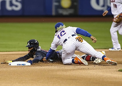 May 29, 2021; New York City, New York, USA; Atlanta Braves right fielder Ronald Acuna Jr. (13) is tagged out by New York Mets shortstop Francisco Lindor (12) trying to steal second base in the first inning at Citi Field. Mandatory Credit: Wendell Cruz-USA TODAY Sports