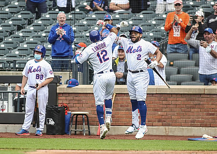 Jun 12, 2021; New York City, New York, USA; New York Mets shortstop Francisco Lindor (12) is greeted by left fielder Dominic Smith (2) after hitting a two-run home run during the first inning against the San Diego Padres at Citi Field. Mandatory Credit: Wendell Cruz-USA TODAY Sports