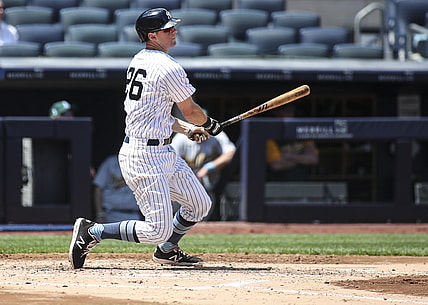 Jun 20, 2021; Bronx, New York, USA; New York Yankees second baseman DJ LeMahieu (26) hits a double in the third inning against the Oakland Athletics at Yankee Stadium. Mandatory Credit: Wendell Cruz-USA TODAY Sports