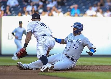 Jun 23, 2021; Bronx, New York, USA; Kansas City Royals catcher Salvador Perez (13) slides into second base after hitting a double in the first inning against the New York Yankees at Yankee Stadium. Mandatory Credit: Wendell Cruz-USA TODAY Sports