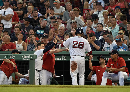Jun 29, 2021; Boston, Massachusetts, USA; Boston Red Sox designated hitter J.D. Martinez (28) is greeted in the dugout after scoring a run during the third inning against the Kansas City Royals at Fenway Park. Mandatory Credit: Bob DeChiara-USA TODAY Sports
