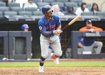 Jul 3, 2021; Bronx, New York, USA;  New York Mets shortstop Francisco Lindor (12) hits a single in the fifth inning against the New York Yankees at Yankee Stadium. Mandatory Credit: Wendell Cruz-USA TODAY Sports