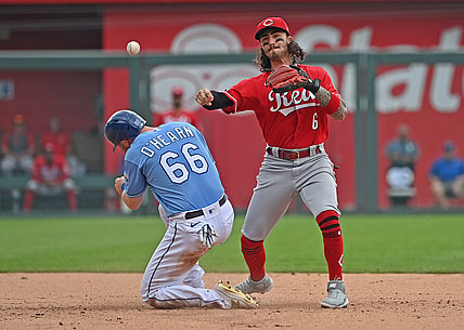 Jul 7, 2021; Kansas City, Missouri, USA; Cincinnati Reds second baseman Jonathan India (6) has his throw to first base hit off Kansas City Royals base runner Ryan O'Hearn's (66) helmet during the fourth inning at Kauffman Stadium. Mandatory Credit: Peter Aiken-USA TODAY Sports