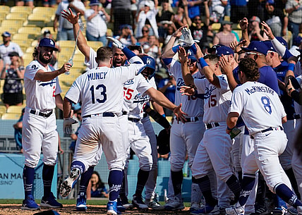 Jul 11, 2021; Los Angeles, California, USA; Los Angeles Dodgers second baseman Max Muncy (13) heads to home plate after hitting a 3-run home run in the bottom of the ninth clear the fence to beat the Arizona Diamondbacks 7-4 at Dodger Stadium. Mandatory Credit: Robert Hanashiro-USA TODAY Sports