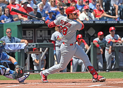 Aug 15, 2021; Kansas City, Missouri, USA; St. Louis Cardinals third baseman Nolan Arenado (28) hits an RBI single during the first inning against the Kansas City Royals at Kauffman Stadium. Mandatory Credit: Peter Aiken-USA TODAY Sports