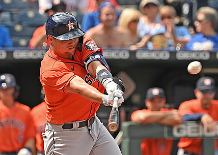 Aug 19, 2021; Kansas City, Missouri, USA;  Houston Astros left fielder Aledmys Diaz (16) hits a RBI double during the sixth inning against the Kansas City Royals at Kauffman Stadium. Mandatory Credit: Peter Aiken-USA TODAY Sports