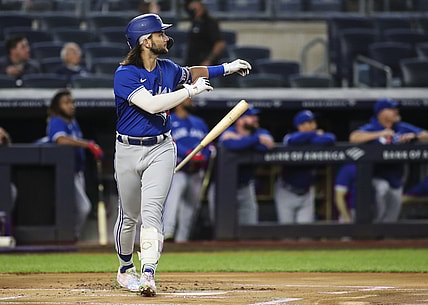 Sep 9, 2021; Bronx, New York, USA; Toronto Blue Jays shortstop Bo Bichette (11) flips his bat after hitting a leadoff solo home run against the New York Yankees in the first inning at Yankee Stadium. Mandatory Credit: Wendell Cruz-USA TODAY Sports