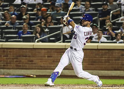 Sep 12, 2021; New York City, New York, USA; New York Mets right fielder Michael Conforto (30) hits an RBI single in the first inning against the New York Yankees at Citi Field. Mandatory Credit: Wendell Cruz-USA TODAY Sports