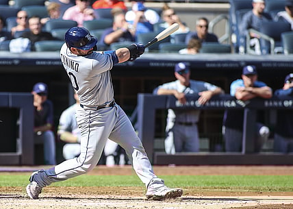 Oct 2, 2021; Bronx, New York, USA; Tampa Bay Rays catcher Mike Zunino (10) hits a solo home run in the third inning against the New York Yankees at Yankee Stadium. Mandatory Credit: Wendell Cruz-USA TODAY Sports