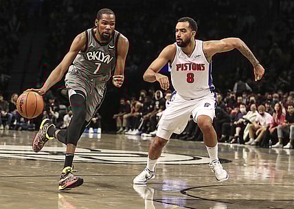 Oct 31, 2021; Brooklyn, New York, USA;  Brooklyn Nets forward Kevin Durant (7) drives past Detroit Pistons forward Trey Lyles (8) in the third quarter at Barclays Center. Mandatory Credit: Wendell Cruz-USA TODAY Sports