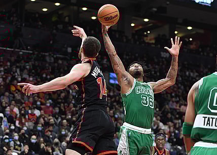 Nov 28, 2021; Toronto, Ontario, CAN;  Boston Celtics guard Marcus Smart (36) contests a rebound with Toronto Raptors guard Svi Mykhailiuk (14) in the first half at Scotiabank Arena. Mandatory Credit: Dan Hamilton-USA TODAY Sports