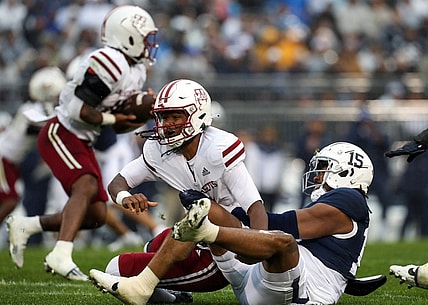 Oct 14, 2023; University Park, Pennsylvania, USA; Penn State Nittany Lions defensive end Amin Vanover (15) tackles Massachusetts Minutemen quarterback Taisun Phommachanh (3) in the back field during the first quarter at Beaver Stadium. Mandatory Credit: Matthew O'Haren-USA TODAY Sports