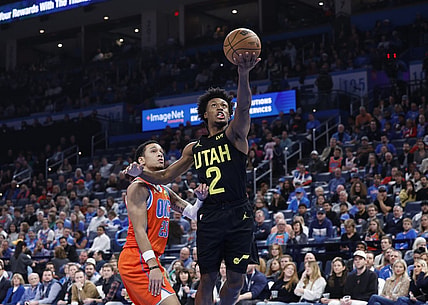 Dec 11, 2023; Oklahoma City, Oklahoma, USA; Utah Jazz guard Collin Sexton (2) shoots in front of Oklahoma City Thunder guard Tre Mann (23) during the second half at Paycom Center. Mandatory Credit: Alonzo Adams-USA TODAY Sports