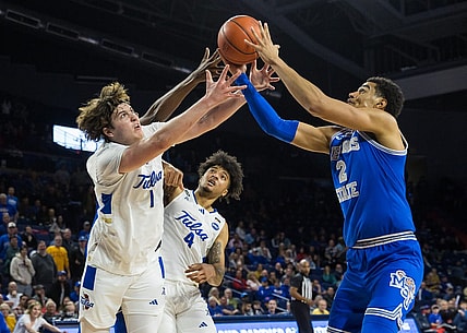 Jan 4, 2024; Tulsa, Oklahoma, USA; Tulsa Golden Hurricane forward Matt Reed (1) and guard PJ Haggerty (4) go for a loose ball against Memphis Tigers forward Nick Jourdain (2) during the second half at the Reynolds Center. The Memphis Tigers won the game 78-75. Mandatory Credit: Brett Rojo-USA TODAY Sports