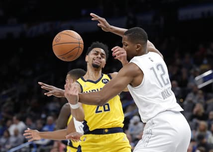 Jan 28, 2022; Oklahoma City, Oklahoma, USA; Indiana Pacers guard Jeremy Lamb (26) looses the ball as Oklahoma City Thunder forward Mamadi Diakite (12) defends him on a drive to the basket during the second quarter at Paycom Center. Mandatory Credit: Alonzo Adams-USA TODAY Sports
