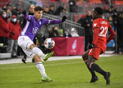 Nov 3, 2021; Toronto, Ontario, Canada;   Pacific FC defender Kadin Chung (2) controls the ball in front of Toronto FC defender Richie Laryea (22) in the first half of a the Canadian Championship semi-final at BMO Field. Mandatory Credit: Dan Hamilton-USA TODAY Sports