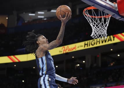 Mar 13, 2022; Oklahoma City, Oklahoma, USA; Memphis Grizzlies guard Ja Morant (12) goes to the basket against the Oklahoma City Thunder during the second half at Paycom Center. Memphis won 125-118. Mandatory Credit: Alonzo Adams-USA TODAY Sports