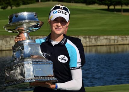 Jun 27, 2021; John's Creek, Georgia, USA; Nelly Korda holds the championship trophy as she celebrates winning the KPMG Women's PGA Championship golf tournament at the Atlanta Athletic Club. Mandatory Credit: Adam Hagy-USA TODAY Sports