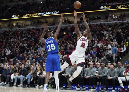 Dec 10, 2022; Chicago, Illinois, USA; Chicago Bulls forward DeMar DeRozan (11) shoots the ball over Dallas Mavericks forward Reggie Bullock (25) during the first quarter at United Center. Mandatory Credit: David Banks-USA TODAY Sports