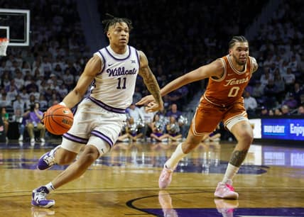 Feb 4, 2023; Manhattan, Kansas, USA; Kansas State Wildcats guard Keyontae Johnson (11) dribbles the ball against Texas Longhorns forward Timmy Allen (0) during the first half at Bramlage Coliseum. Mandatory Credit: Scott Sewell-USA TODAY Sports