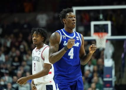 Feb 18, 2023; Storrs, Connecticut, USA; Seton Hall Pirates forward Tyrese Samuel (4) and UConn Huskies guard Tristen Newton (2) react after a play in the first half at Harry A. Gampel Pavilion. Mandatory Credit: David Butler II-USA TODAY Sports
