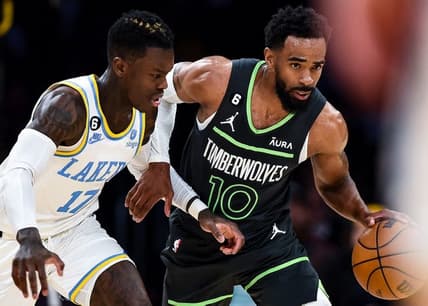 Mar 3, 2023; Los Angeles, California, USA; Minnesota Timberwolves guard Mike Conley (10) moves the ball against Los Angeles Lakers guard Dennis Schroder (17) during the second quarter at Crypto.com Arena. Mandatory Credit: Jonathan Hui-USA TODAY Sports