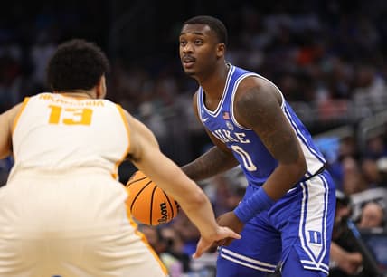 Mar 18, 2023; Orlando, FL, USA;  Duke Blue Devils forward Dariq Whitehead (0) is defended by Tennessee Volunteers forward Olivier Nkamhoua (13) during the first half in the second round of the 2023 NCAA Tournament at Legacy Arena. Mandatory Credit: Matt Pendleton-USA TODAY Sports