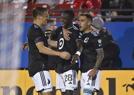 Feb 25, 2023; Frisco, Texas, USA; Minnesota United forward Mender Garcia (28) and forward Franco Fragapane (7) and midfielder Robin Lod (17) celebrate a goal during the game between Minnesota United and FC Dallas at the Toyota Stadium. Mandatory Credit: Jerome Miron-USA TODAY Sports