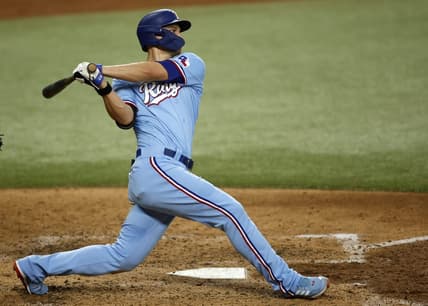 Jun 18, 2023; Arlington, Texas, USA; Texas Rangers shortstop Corey Seager (5) hits a two RBI double in the fourth inning against the Toronto Blue Jays at Globe Life Field. Mandatory Credit: Tim Heitman-USA TODAY Sports