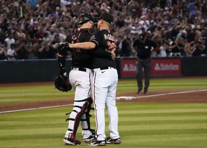 Jul 29, 2023; Phoenix, Arizona, USA; Arizona Diamondbacks catcher Carson Kelly (18) and Arizona Diamondbacks relief pitcher Scott McGough (30) celebrate after defeating the Seattle Mariners at Chase Field. Mandatory Credit: Joe Camporeale-USA TODAY Sports
