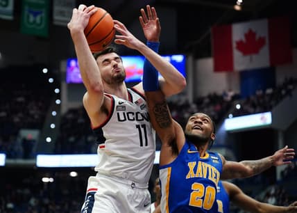 Jan 28, 2024; Hartford, Connecticut, USA; UConn Huskies forward Alex Karaban (11) works for the rebound against Xavier Musketeers guard Dayvion McKnight (20) in the first half at XL Center. Mandatory Credit: David Butler II-USA TODAY Sports