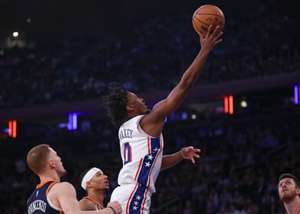 Mar 12, 2024; New York, New York, USA; Philadelphia 76ers guard Tyrese Maxey (0) shoots the ball against the New York Knicks New York Knicks guard Donte DiVincenzo (0) during the first quarter at Madison Square Garden. Mandatory Credit: Vincent Carchietta-USA TODAY Sports