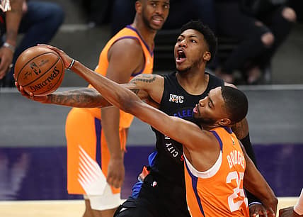 May 7, 2021; Phoenix, Arizona, USA; Phoenix Suns forward Mikal Bridges (25) blocks the shot of New York Knicks guard Elfrid Payton in the first half at Phoenix Suns Arena. Mandatory Credit: Mark J. Rebilas-USA TODAY Sports