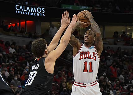 Dec 20, 2021; Chicago, Illinois, USA;   Chicago Bulls forward DeMar DeRozan (11) shoots the ball against Houston Rockets center Alperen Sengun (28) during the first half at the United Center. Mandatory Credit: Matt Marton-USA TODAY Sports