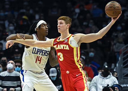 Jan 9, 2022; Los Angeles, California, USA; LA Clippers guard Terance Mann (14) defends Atlanta Hawks guard Kevin Huerter (3) on the baseline during the second quarter at Crypto.com Arena. Mandatory Credit: Robert Hanashiro-USA TODAY Sports