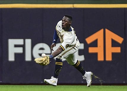 Jul 26, 2022; Milwaukee, Wisconsin, USA;  Milwaukee Brewers center fielder Jonathan Davis (3) catches ball hit by Minnesota Twins third baseman Gio Urshela (not pictured) in the seventh inning at American Family Field. Mandatory Credit: Benny Sieu-USA TODAY Sports