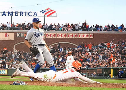 Aug 2, 2022; San Francisco, California, USA; San Francisco Giants right fielder Luis Gonzalez (51) scores ahead of Los Angeles Dodgers starting pitcher Tyler Anderson (31) on a wild pitch during the fourth inning at Oracle Park. Mandatory Credit: Kelley L Cox-USA TODAY Sports