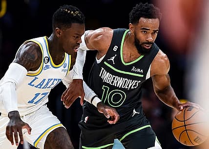 Mar 3, 2023; Los Angeles, California, USA; Minnesota Timberwolves guard Mike Conley (10) moves the ball against Los Angeles Lakers guard Dennis Schroder (17) during the second quarter at Crypto.com Arena. Mandatory Credit: Jonathan Hui-USA TODAY Sports
