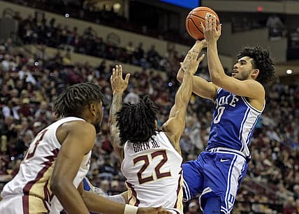 Feb 17, 2024; Tallahassee, Florida, USA; Duke Blue Devils guard Jared McCain (0) shoots the ball over Florida State Seminoles guard Darin Green Jr (22) during the second half at Donald L. Tucker Center. Mandatory Credit: Melina Myers-USA TODAY Sports