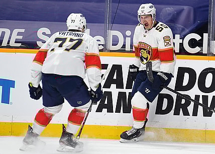 Mar 6, 2021; Nashville, Tennessee, USA; Florida Panthers center Noel Acciari (55) celebrates with center Frank Vatrano (77) after a second period goal against the Nashville Predators at Bridgestone Arena. Mandatory Credit: Christopher Hanewinckel-USA TODAY Sports